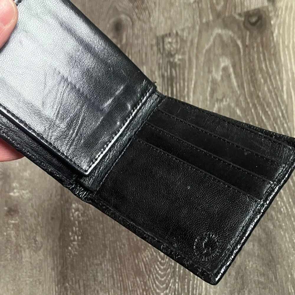 black bifold wallet made from genuine ostrich leather.